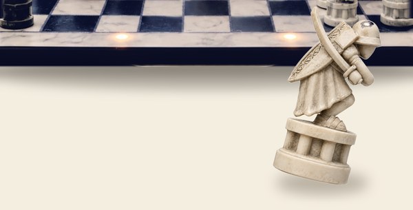 A white GoChess Wizard pawn tipping off the edge of the board