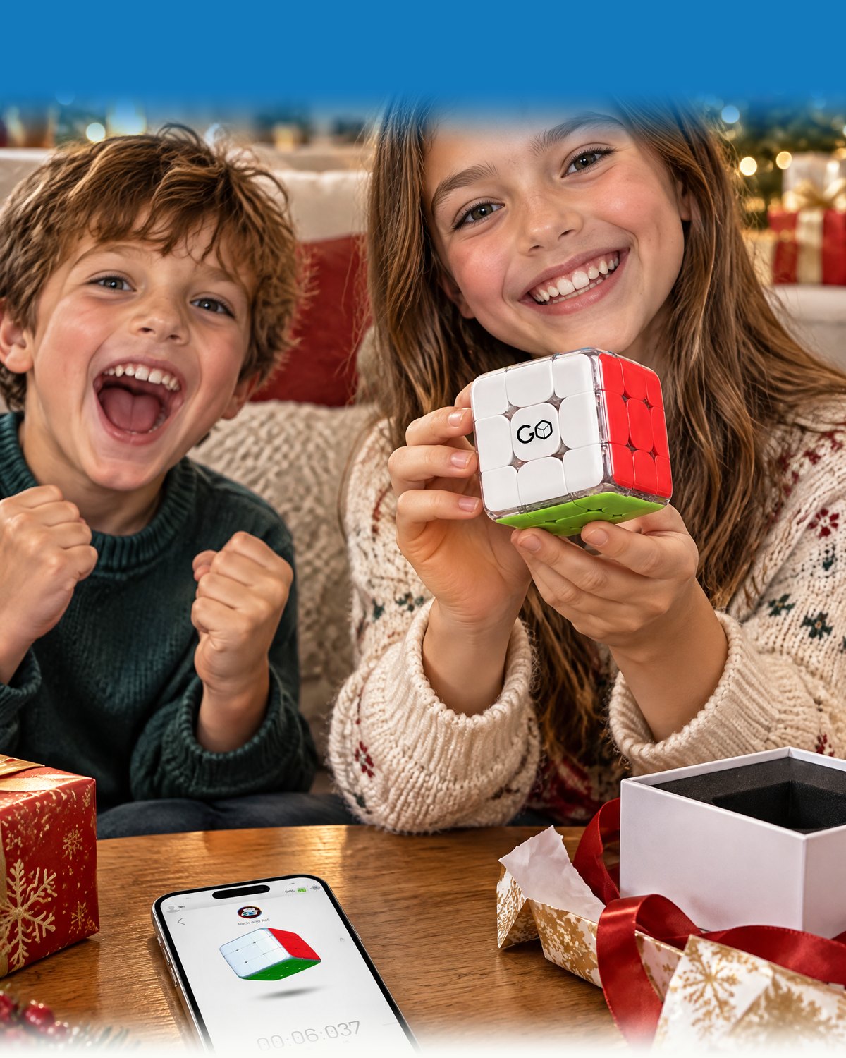 Two kids opening GoCube at Christmas, the app open on a phone