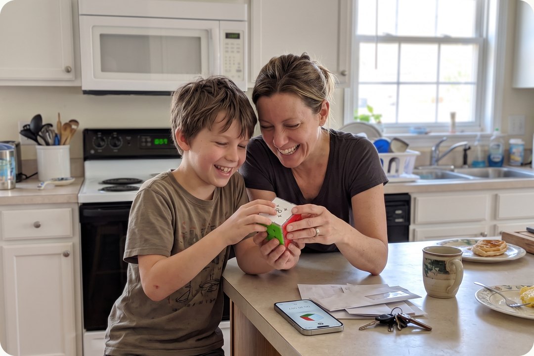A mom and son laughing over GoCube in the kitchen