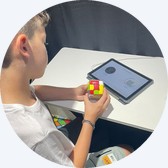 A boy playing a GoCube game on a tablet