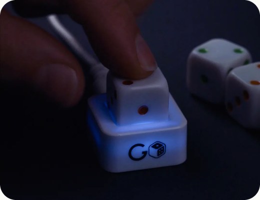 A GoDice die charging in its case