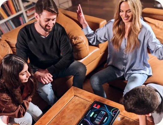 A family playing GoDice around a tablet