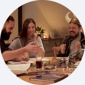 Friends rolling dice at an RPG table