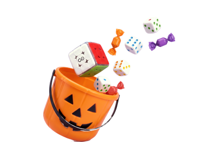 GoCube and GoDice spilling out of a jack-o&rsquo;-lantern candy pail