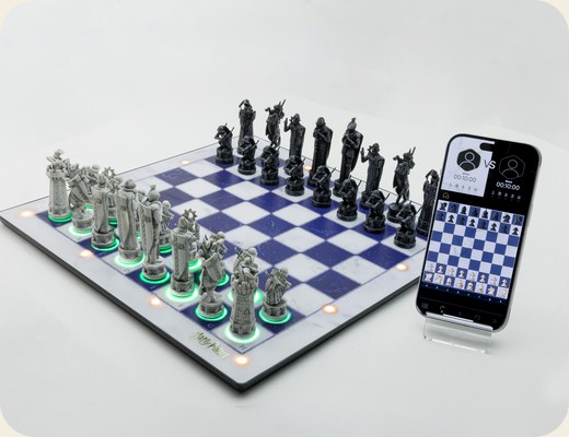 The GoChess Wizard board beside a phone running the GoChess app