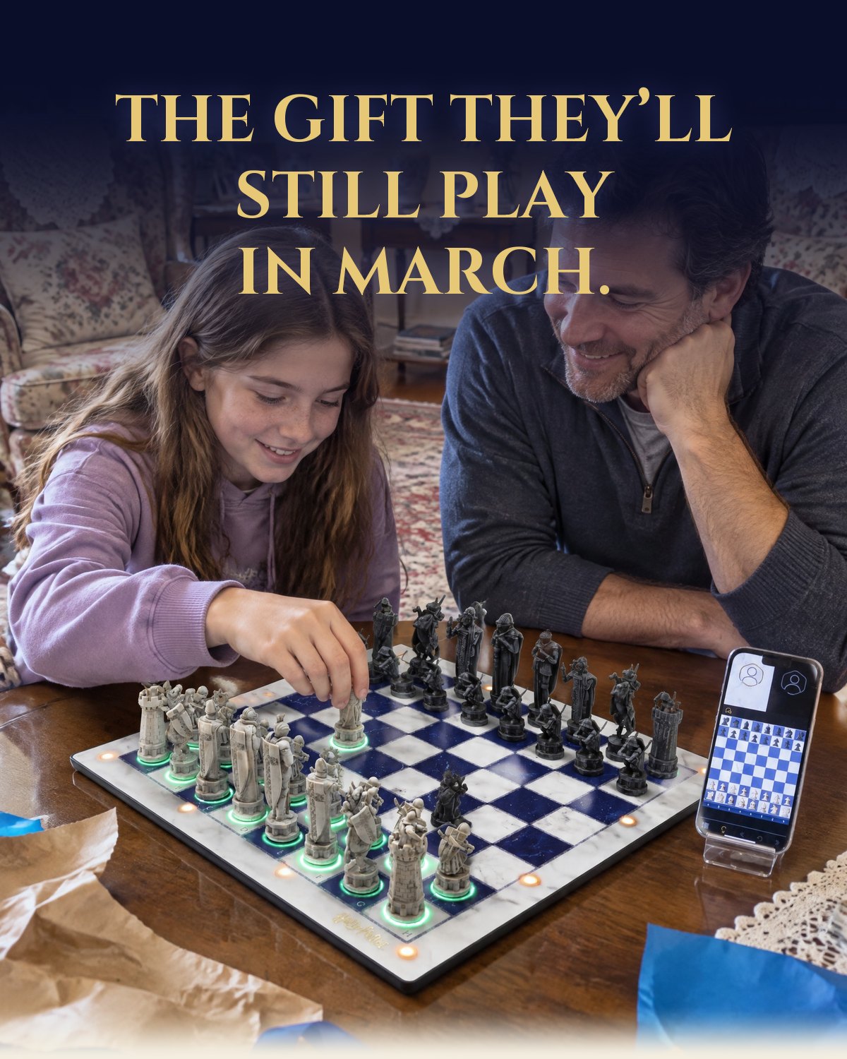 The gift they will still play in March. A dad and daughter playing GoChess Wizard among the wrapping paper.